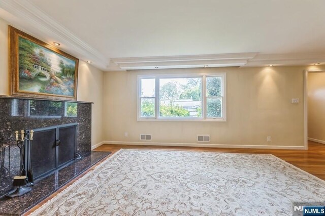 277 Jefferson Ave, Cresskill, NJ 07626 - unfurnished living room featuring wood finished floors, baseboards, a high end fireplace, and ornamental molding