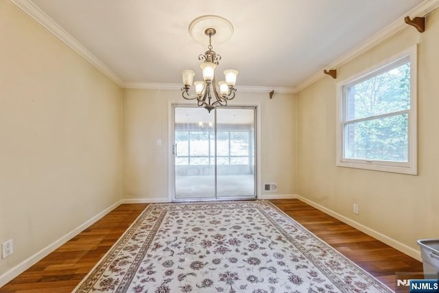 277 Jefferson Ave, Cresskill, NJ 07626 - unfurnished dining area featuring a chandelier, dark wood-style floors, ornamental molding, and baseboards