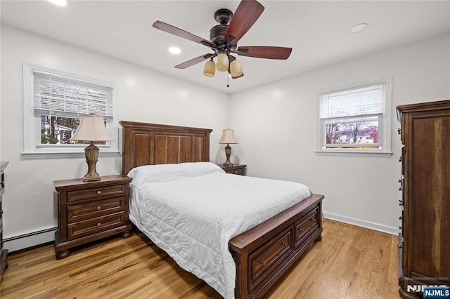 70 Highland Rd, North Haledon, NJ 07508 - bedroom featuring a baseboard radiator, light wood-style floors, recessed lighting, a ceiling fan, and baseboards