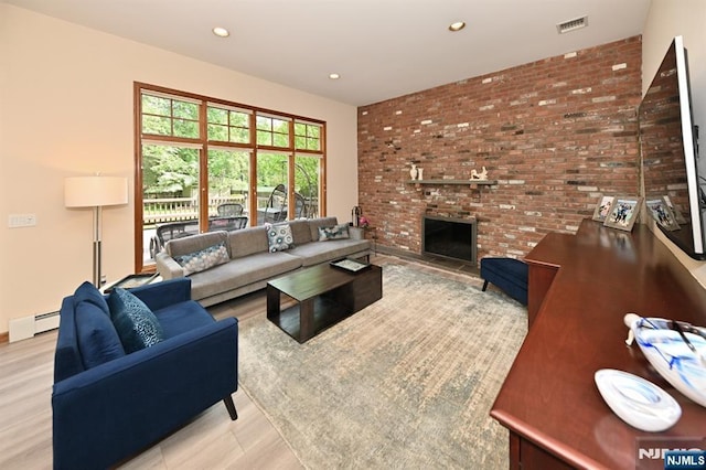 24 Old Chimney Rd, Upper Saddle River, NJ 07458 - living area featuring wood finished floors, recessed lighting, baseboard heating, a brick fireplace, and brick wall