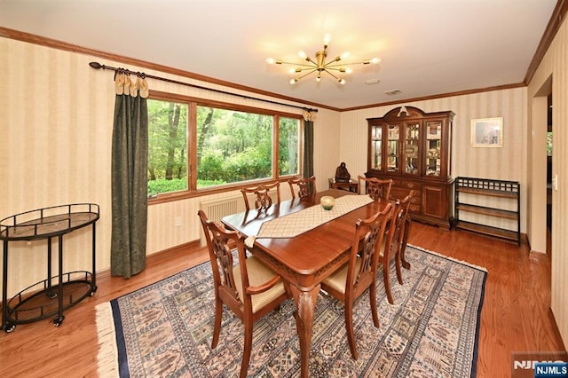 24 Old Chimney Rd, Upper Saddle River, NJ 07458 - dining space featuring wallpapered walls, wood finished floors, crown molding, a chandelier, and baseboards