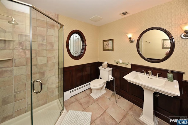 24 Old Chimney Rd, Upper Saddle River, NJ 07458 - full bathroom featuring baseboard heating, toilet, a wainscoted wall, a shower stall, and tile patterned flooring