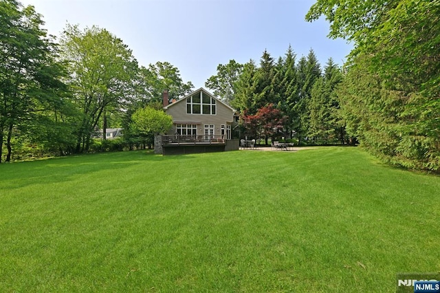 24 Old Chimney Rd, Upper Saddle River, NJ 07458 - view of green lawn featuring a wooden deck