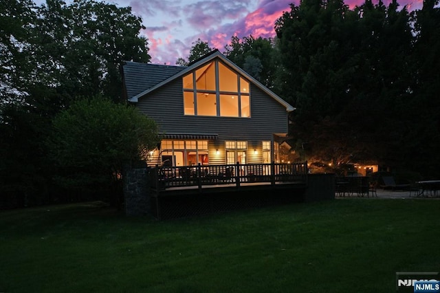 24 Old Chimney Rd, Upper Saddle River, NJ 07458 - back of house at dusk with a deck and a yard