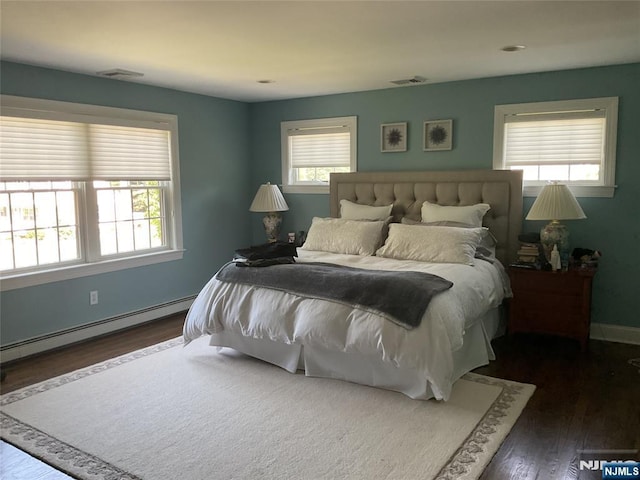 65 1st St, Allendale, NJ 07401 - bedroom featuring dark wood-type flooring, baseboard heating, and baseboards