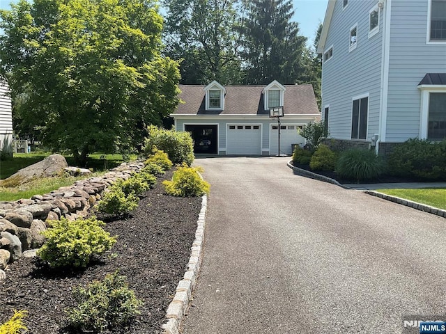 65 1st St, Allendale, NJ 07401 - view of property exterior with asphalt driveway and an attached garage