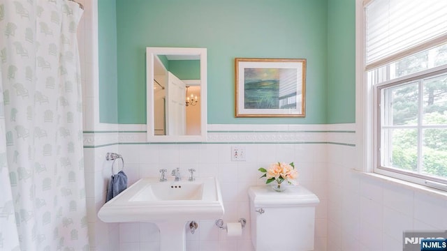 466 Park St, Montclair, NJ 07043 - full bath featuring toilet, tile walls, wainscoting, and a shower with shower curtain