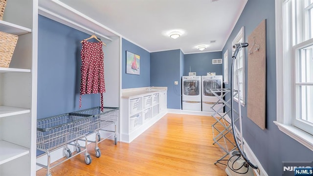 466 Park St, Montclair, NJ 07043 - hallway featuring washing machine and dryer, wood finished floors, ornamental molding, a sink, and baseboards
