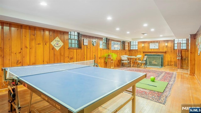 466 Park St, Montclair, NJ 07043 - rec room featuring wooden walls, a fireplace, wood finished floors, plenty of natural light, and recessed lighting