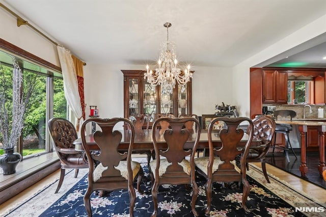 1060 Briar Way, Fort Lee, NJ 07024 - dining space with a chandelier, healthy amount of natural light, and wood finished floors