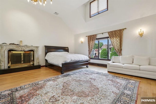 1060 Briar Way, Fort Lee, NJ 07024 - bedroom featuring lofted ceiling, a chandelier, and wood finished floors