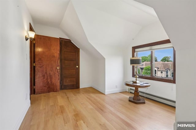 1060 Briar Way, Fort Lee, NJ 07024 - additional living space featuring a baseboard heating unit, light wood-style flooring, and vaulted ceiling