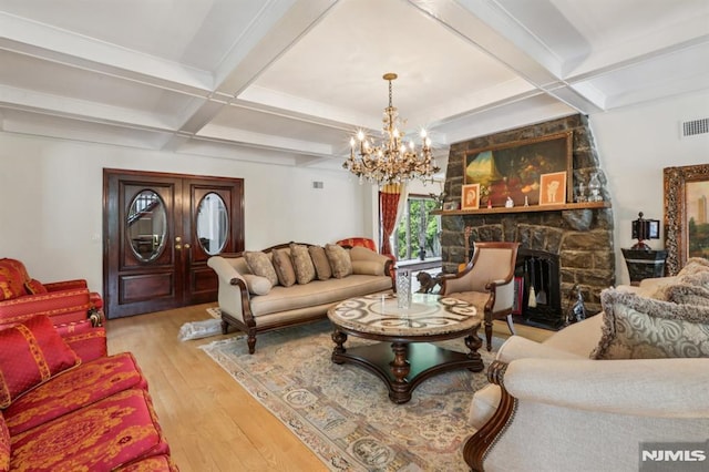 1060 Briar Way, Fort Lee, NJ 07024 - living area with coffered ceiling, hardwood / wood-style floors, a chandelier, beam ceiling, and a stone fireplace