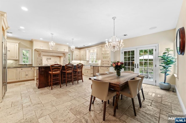 56 Knoll Rd, Tenafly, NJ 07670 - dining space with a chandelier, stone tile flooring, recessed lighting, french doors, and baseboards
