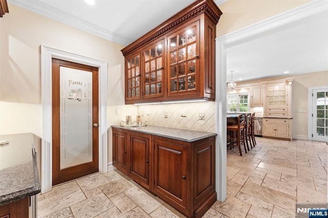 56 Knoll Rd, Tenafly, NJ 07670 - bar featuring stone tile flooring, decorative backsplash, ornamental molding, recessed lighting, and baseboards