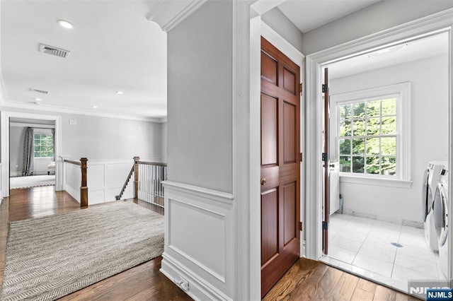 56 Knoll Rd, Tenafly, NJ 07670 - foyer with washer and dryer, healthy amount of natural light, ornamental molding, dark wood-style flooring, and recessed lighting