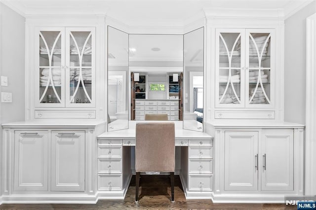 56 Knoll Rd, Tenafly, NJ 07670 - office with built in study area, crown molding, and dark wood-type flooring