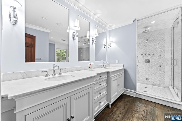 56 Knoll Rd, Tenafly, NJ 07670 - bathroom with crown molding, a stall shower, double vanity, wood finished floors, and recessed lighting