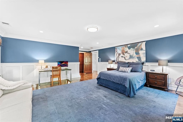 56 Knoll Rd, Tenafly, NJ 07670 - bedroom featuring crown molding, a wainscoted wall, wood finished floors, recessed lighting, and a decorative wall