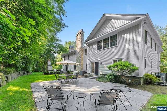 56 Knoll Rd, Tenafly, NJ 07670 - back of house featuring a yard, central AC, a patio area, and entry steps