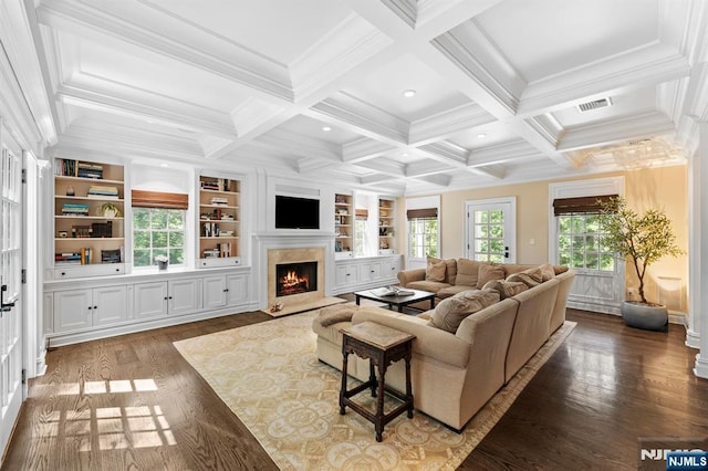 56 Knoll Rd, Tenafly, NJ 07670 - living room with ornamental molding, a high end fireplace, wood finished floors, beam ceiling, and built in shelves