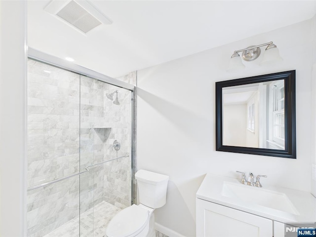 995 Andover Ter, Ridgewood, NJ 07450 - full bathroom featuring toilet, vanity, a stall shower, and baseboards
