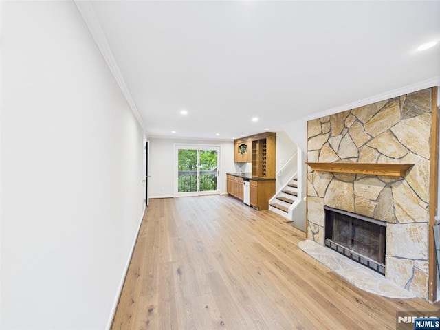 995 Andover Ter, Ridgewood, NJ 07450 - unfurnished living room with crown molding, light wood finished floors, recessed lighting, a fireplace, and baseboards