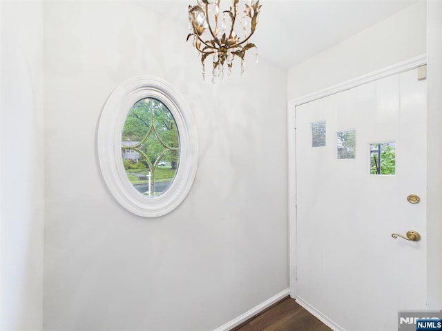 995 Andover Ter, Ridgewood, NJ 07450 - foyer entrance featuring a chandelier, dark wood-style floors, and baseboards
