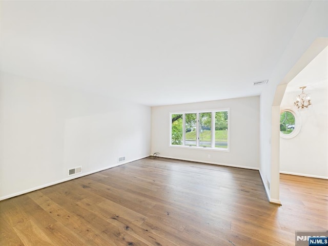 995 Andover Ter, Ridgewood, NJ 07450 - unfurnished room with wood finished floors, a chandelier, and baseboards