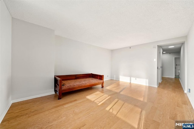 800 Palisade Ave Unit 1804, Fort Lee, NJ 07024 - unfurnished room featuring light wood-style flooring, baseboards, and a textured ceiling