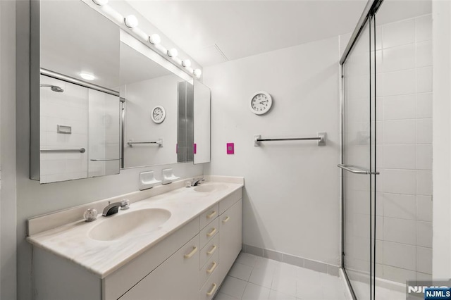 800 Palisade Ave Unit 1804, Fort Lee, NJ 07024 - bathroom featuring double vanity, a tile shower, tile patterned floors, and baseboards