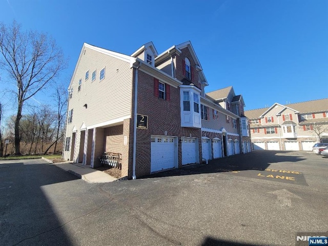 45 Birch St Unit 207, Ridgefield Park, NJ 07660 - view of side of property featuring a residential view and brick siding