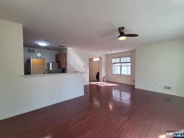 45 Birch St Unit 207, Ridgefield Park, NJ 07660 - unfurnished living room featuring dark wood-style floors, a ceiling fan, and baseboards