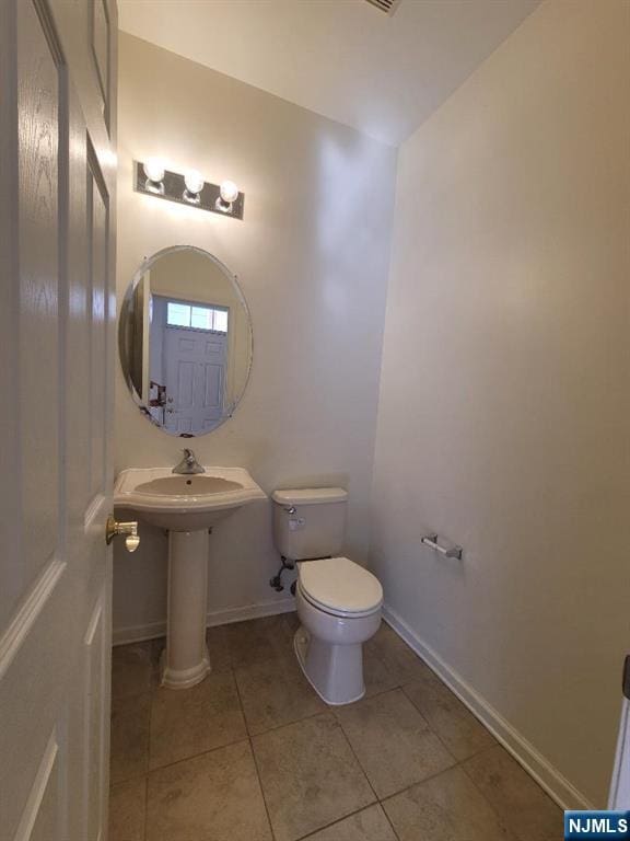 45 Birch St Unit 207, Ridgefield Park, NJ 07660 - bathroom with toilet, tile patterned flooring, and baseboards