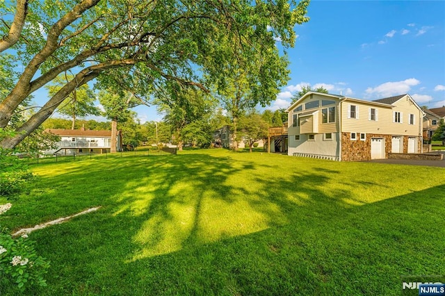11 Hillcrest Blvd, Warren, NJ 07059 - view of green lawn with an attached garage and asphalt driveway