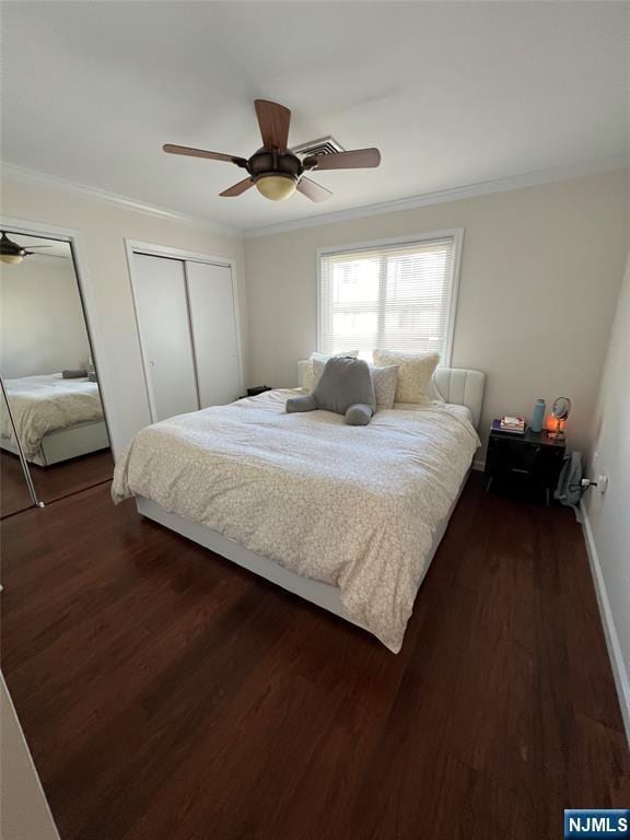 31 Fairmount Ave Unit 4A, Hackensack, NJ 07601 - bedroom with ornamental molding, dark wood finished floors, two closets, ceiling fan, and baseboards