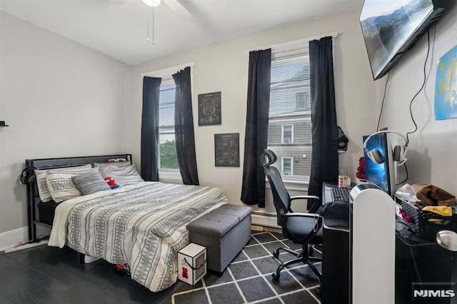 26 Mohawk Ave, Hawthorne, NJ 07506 - bedroom featuring dark wood-type flooring, baseboards, ceiling fan, and a baseboard radiator