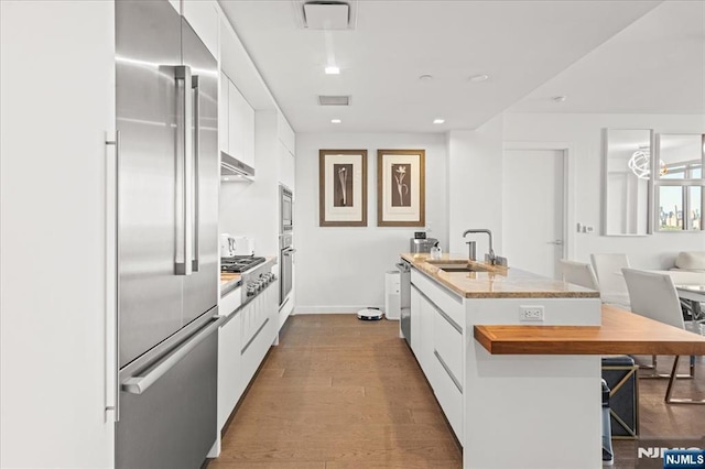 320 Adolphus Ave Unit 317, Cliffside Park, NJ 07010 - kitchen featuring a sink, white cabinetry, an island with sink, modern cabinets, and recessed lighting