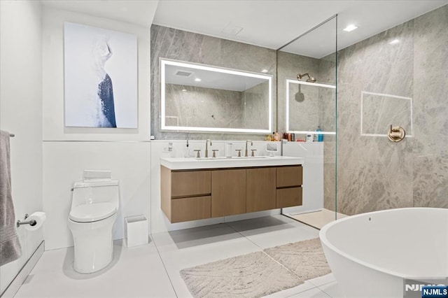 320 Adolphus Ave Unit 317, Cliffside Park, NJ 07010 - bathroom with double vanity, a walk in shower, tile patterned floors, toilet, and a freestanding bath