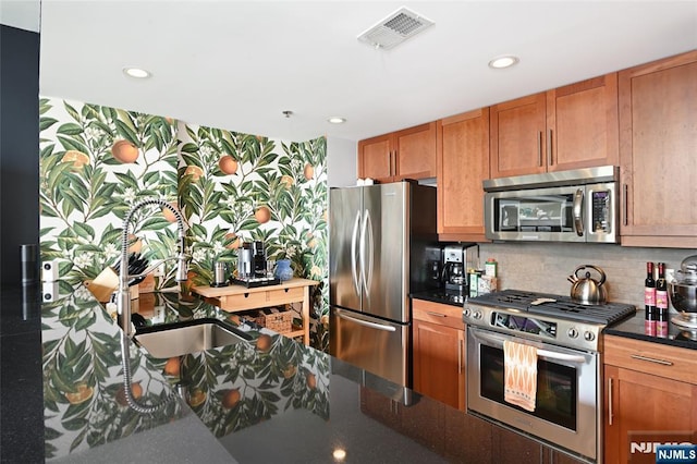 800 Jackson St Unit 505, Hoboken, NJ 07030 - kitchen with stainless steel appliances, recessed lighting, backsplash, and brown cabinetry