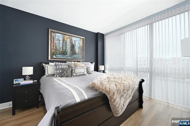 800 Jackson St Unit 505, Hoboken, NJ 07030 - bedroom with light wood finished floors and multiple windows