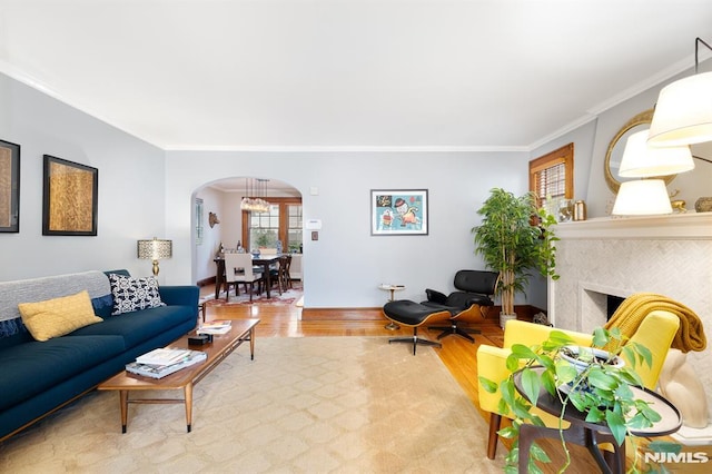 206 Eastern Way, Rutherford, NJ 07070 - living room with arched walkways, wood finished floors, ornamental molding, and a tiled fireplace