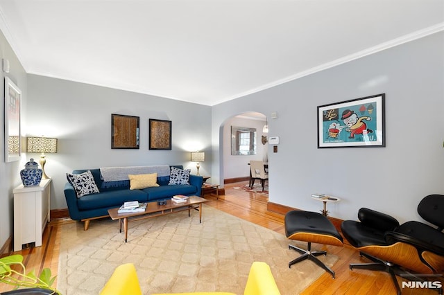 206 Eastern Way, Rutherford, NJ 07070 - living room with arched walkways, light wood-style floors, and ornamental molding