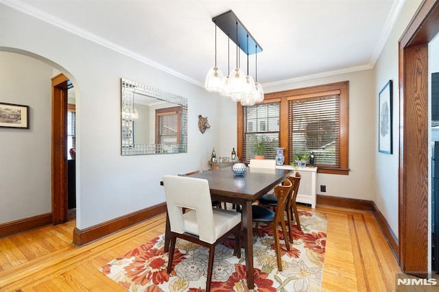 206 Eastern Way, Rutherford, NJ 07070 - dining area featuring light wood-type flooring, arched walkways, ornamental molding, and a chandelier