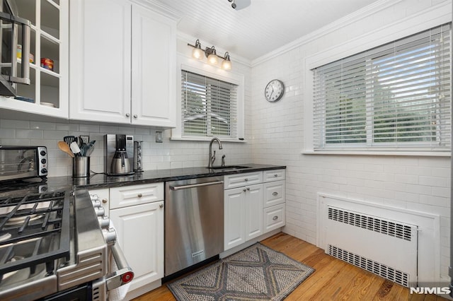 206 Eastern Way, Rutherford, NJ 07070 - kitchen with radiator, dishwasher, stove, crown molding, and light wood-style floors