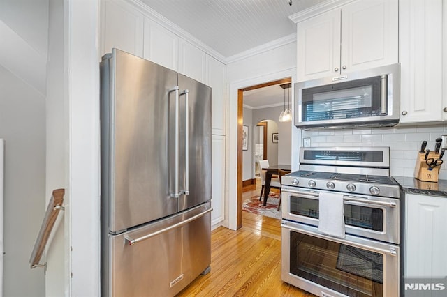 206 Eastern Way, Rutherford, NJ 07070 - kitchen featuring appliances with stainless steel finishes, crown molding, white cabinetry, decorative backsplash, and light wood-style flooring