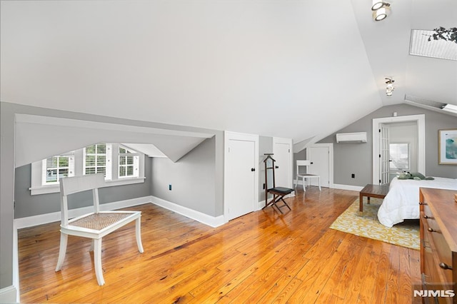 206 Eastern Way, Rutherford, NJ 07070 - living area with a wall mounted AC, vaulted ceiling, and light wood-style flooring