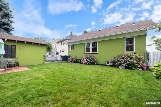 206 Eastern Way, Rutherford, NJ 07070 - back of property with stucco siding, a patio, and a chimney