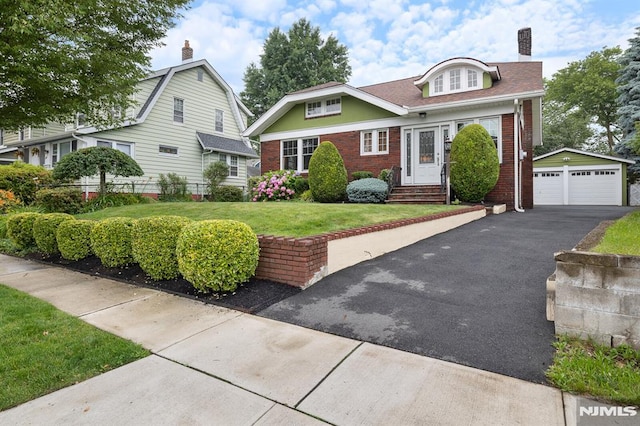 206 Eastern Way, Rutherford, NJ 07070 - view of front of home featuring brick siding, a garage, an outbuilding, and a chimney