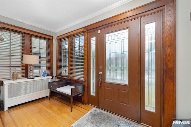206 Eastern Way, Rutherford, NJ 07070 - foyer featuring light wood-style floors, ornamental molding, and radiator